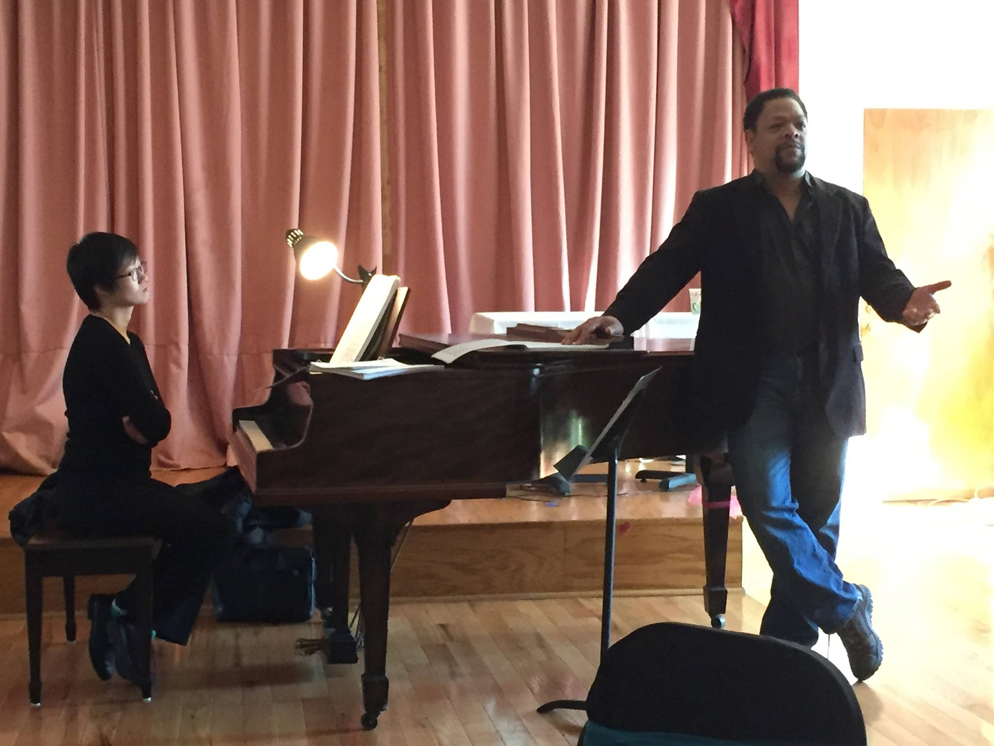 Singer and pianist at grand piano